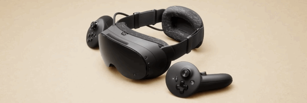 a shot of the steam frame VR system on a brown background - includes controllers.